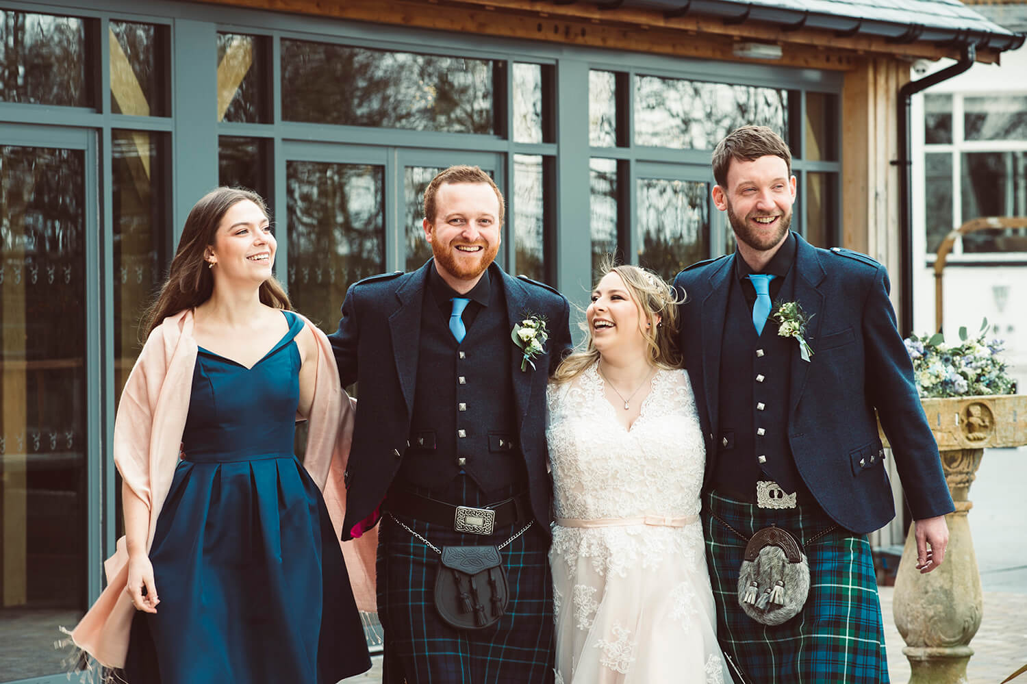 Natural photography of bride and groom with best man and bridesmaid at Enterkine House Hotel by Ayrshire Wedding Photographer Richard Campbell