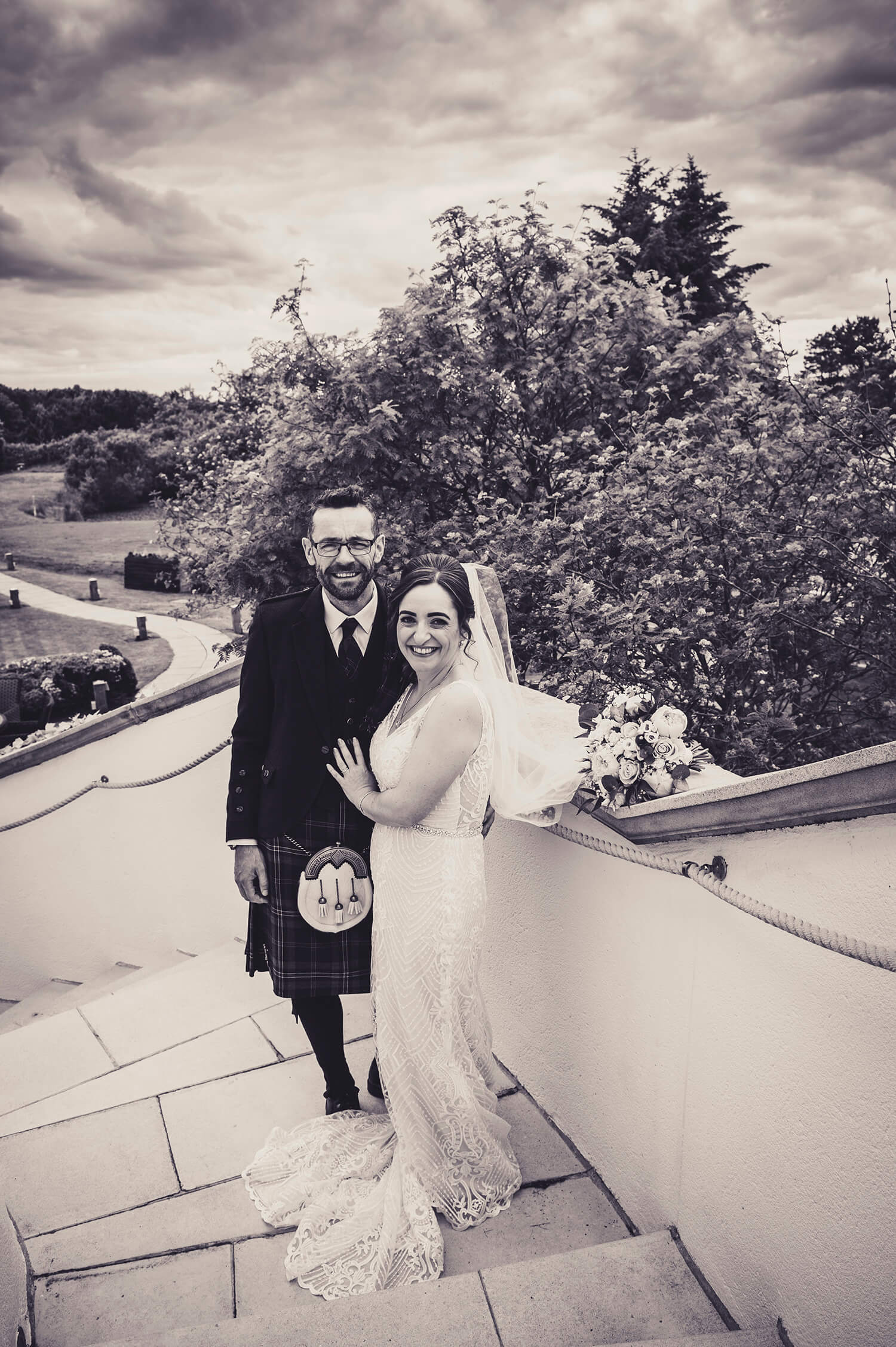 Bride and Groom on stairs at Gailes Hotel Irvine by Ayrshire wedding photographer Richard Campbell