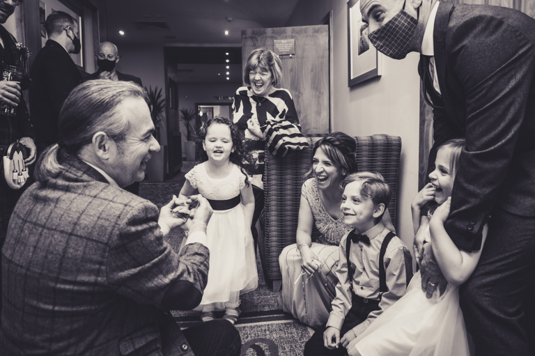 Magician entertaining guests at wedding