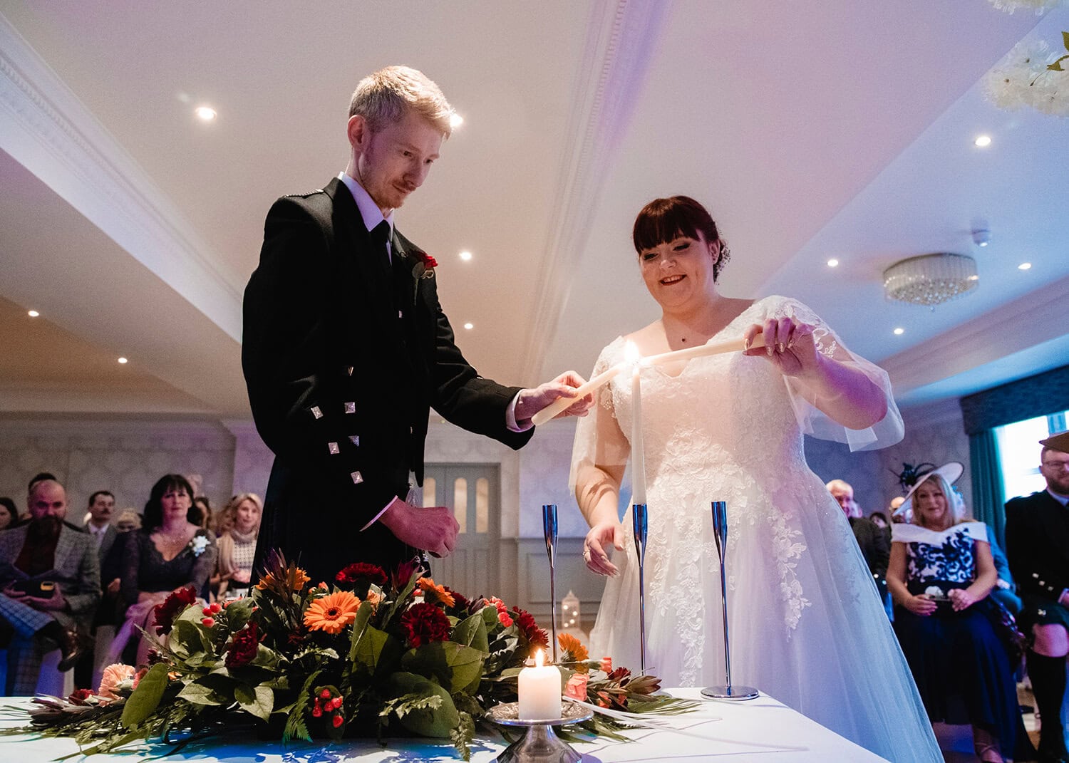 Bride and groom lighting candles at Fairfield Hotel Ayr by Ayrshire wedding photographer Richard Campbell